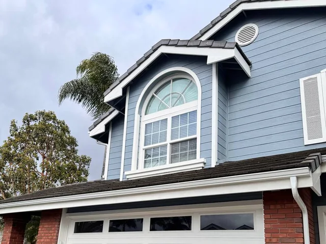 White seamless gutters installed on a Laguna Hills home