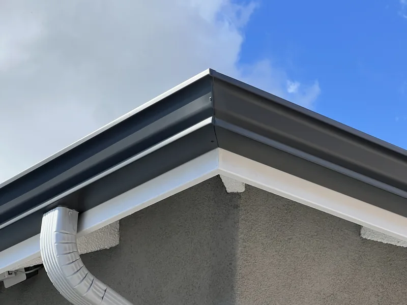 Gutter corner and downspout connection on a residential installation
